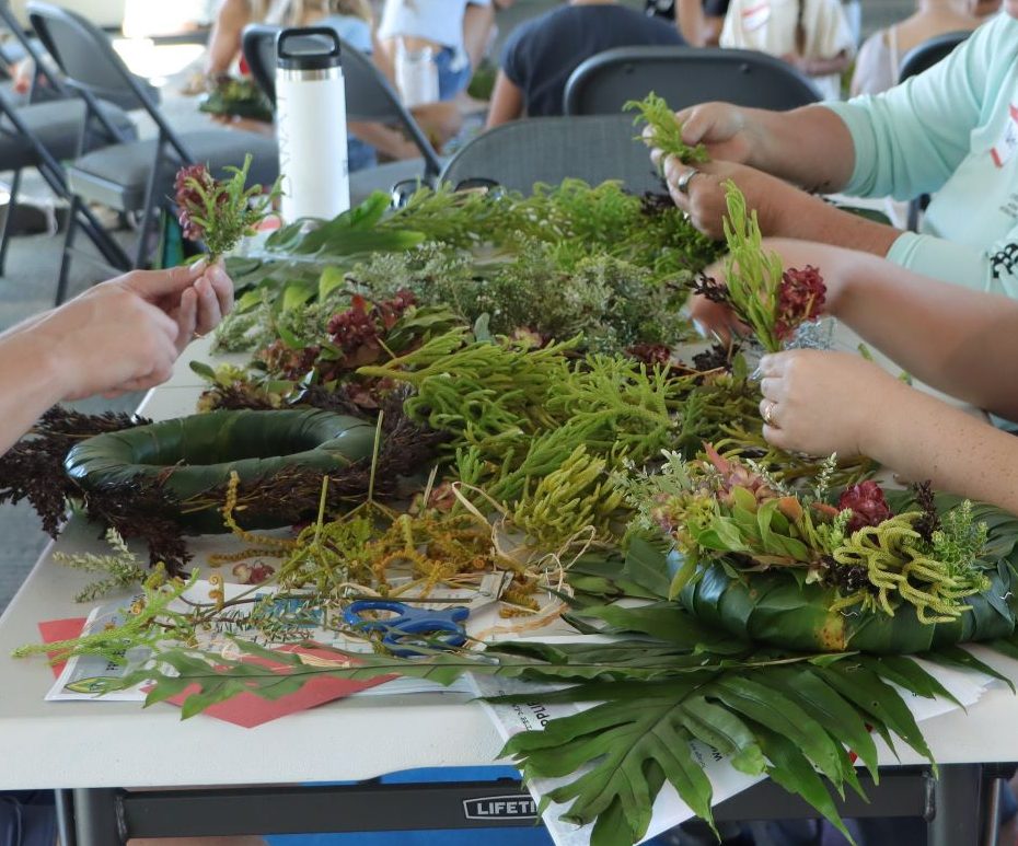 A group of people sorting for large bundles.