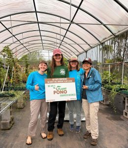 Group pic of BIISC staff (Rosemary Bearden, Molly Murphy, and Darcy Yogi) with nursery manager Lily Stein in the middle. The background is the new greenhouse and endorsed nursery.